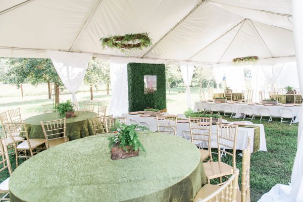 White tent with tables and chairs